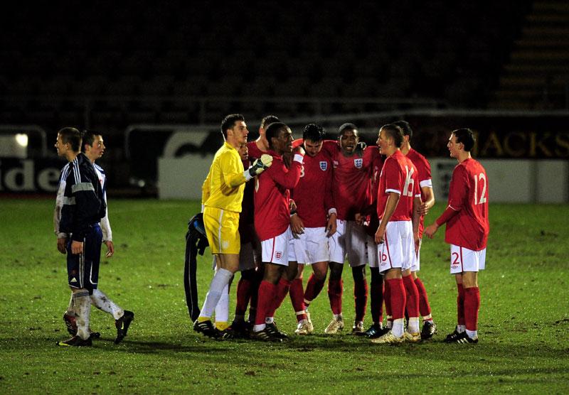 The England U17 players congratulate Harry Kane (No.16) on his goal against Slovakia.